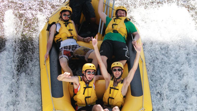 Thrilled rafters conquering Class 5 rapids in Bali