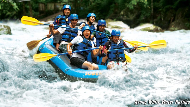 Joyful rafters experiencing mental wellness on a white water rafting adventure on Bali's Ayung River