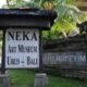 Entrance sign to Neka Art Museum Ubud, Bali surrounded by lush greenery