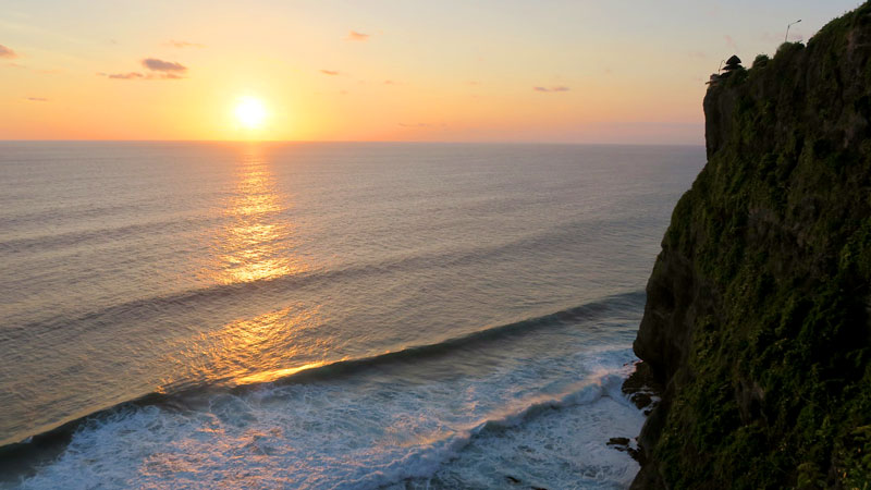 Sunset view from Uluwatu Temple with the Indian Ocean below.