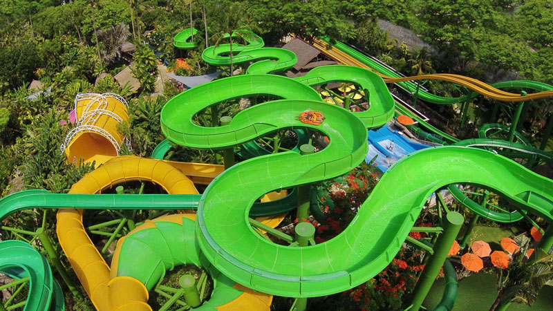 Families enjoying exhilarating water slides and attractions at Bali Waterbom Water Park in Kuta.