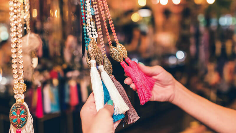 Colorful tassel necklaces at a Kuta Bali market showcasing local craftsmanship