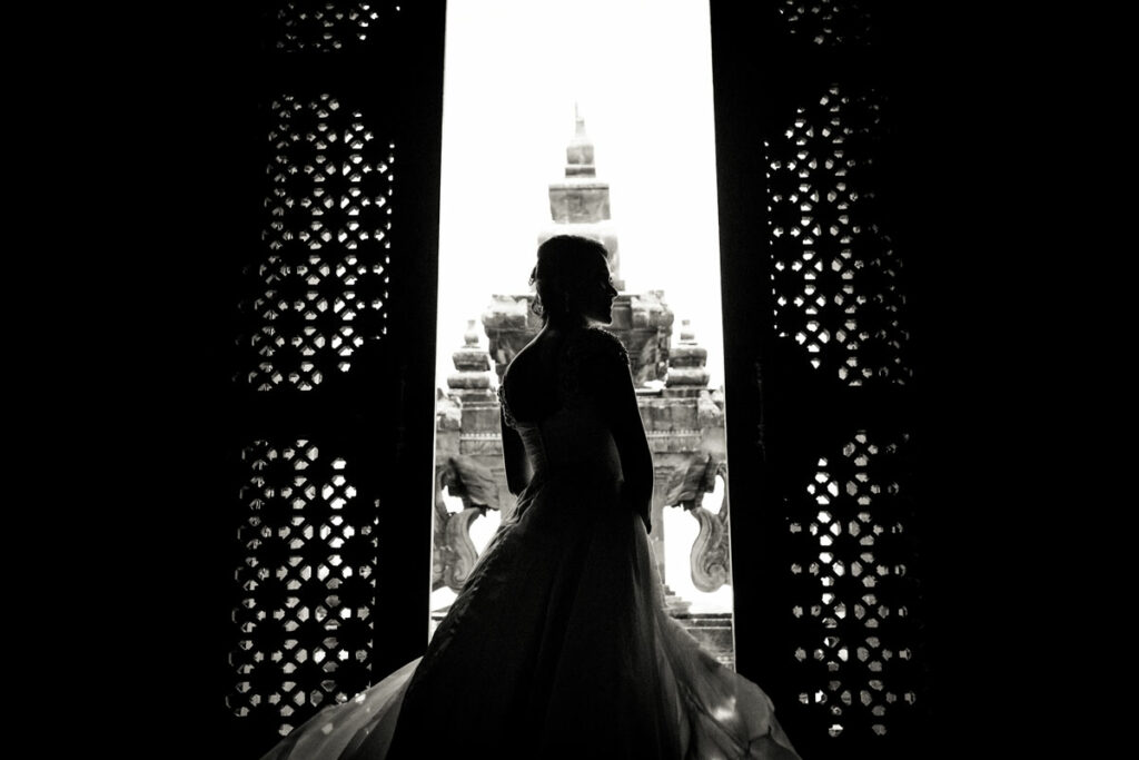 Bride silhouetted against Bajra Sandhi Monument, a prime pre-wedding location in Bali