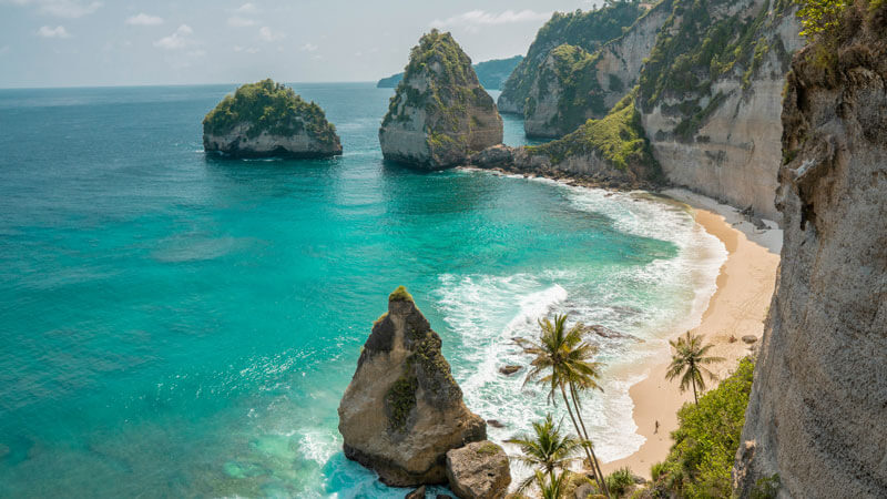 White sandy beach with bright blue sky in Bali during the dry season