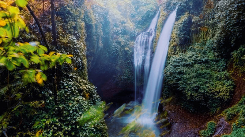 The stunning Aling-Aling Waterfall is surrounded by tropical forests in North Bali