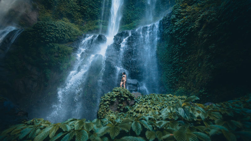 Visitors enjoy the enchanting beauty of Cascade in North Bali