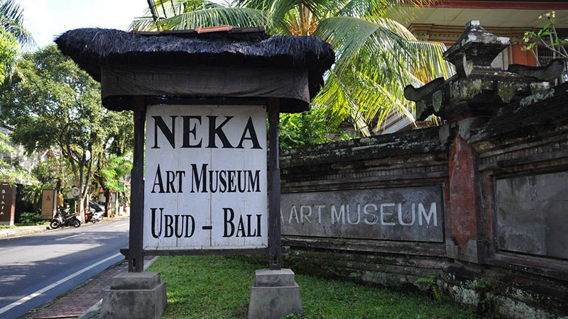 Entrance sign to Neka Art Museum Ubud, Bali surrounded by lush greenery