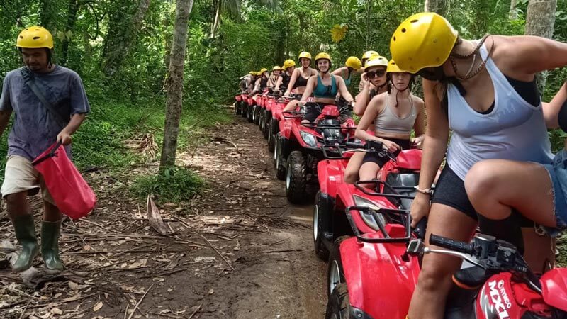 Essential safety equipment for ATV riding in Bali, including helmets and boots.