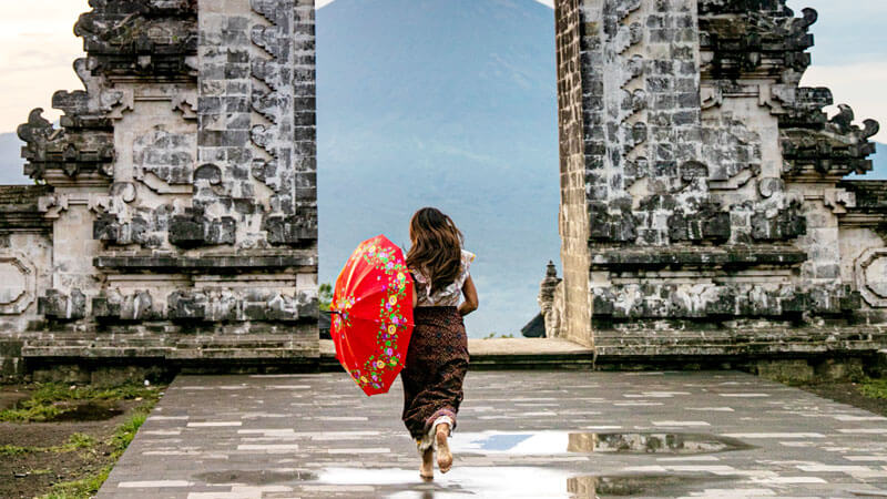 Tourist donned in a sarong at a Balinese temple Guide for First-Timers