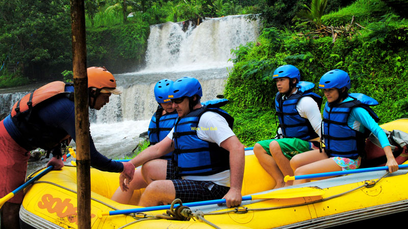 Rafting Guide Helping Participants Telaga Waja