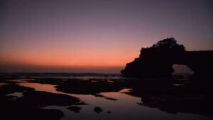 Sunset at Tanah Lot Temple with orange and red sky