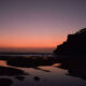 Sunset at Tanah Lot Temple with orange and red sky