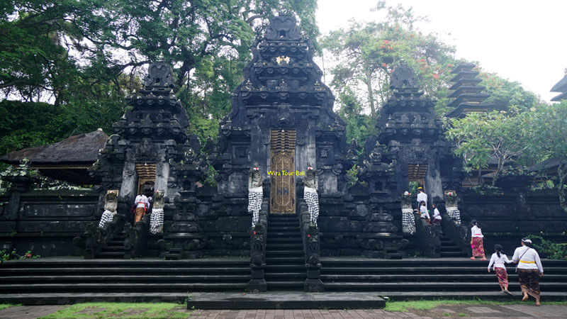 Goa Lawah Temple entrance with dense vegetation in Bali