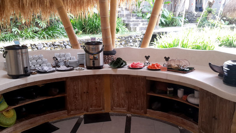 Buffet spread with traditional Indonesian and international cuisine options at a Bali rafting stop.