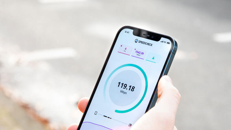 Person checking internet speed on smartphone