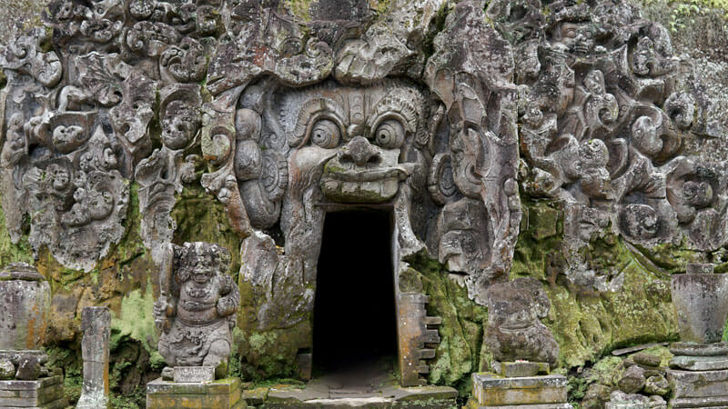 Intricate stone carvings at the entrance of Goa Gajah, the Elephant Cave in Bali