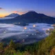 View of thick fog and sunrise in Pinggan Kintamani Village.