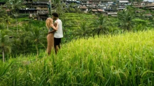 Couple standing in Bali's green rice terraces, ideal for first-time travelers exploring Bali's nature and culture.