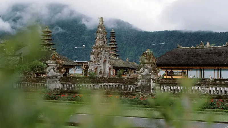 Main temple gate of Ulun Danu Beratan in mist, a reminder to respect sacred areas and temple customs.