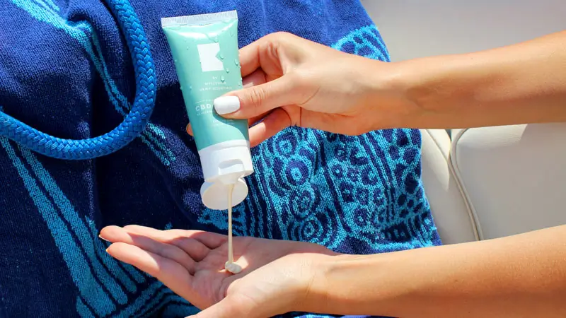 Applying sunscreen before rafting trip under Bali sun
