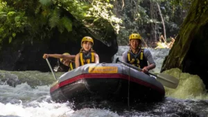Two travelers rafting calmly through Bali’s Ayung River jungle