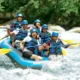 Smiling group rafting on Ayung River in Bali during a scenic and safe white water adventure