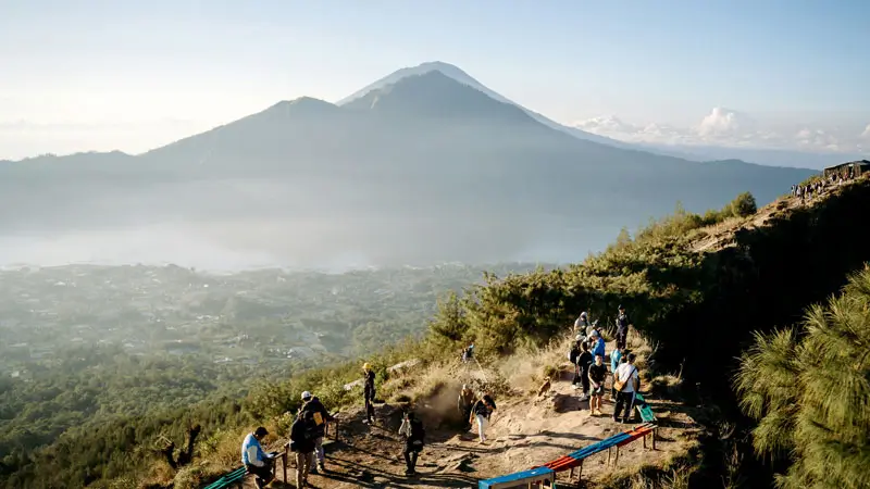 Trekkers enjoying sunrise from Mount Batur trek.