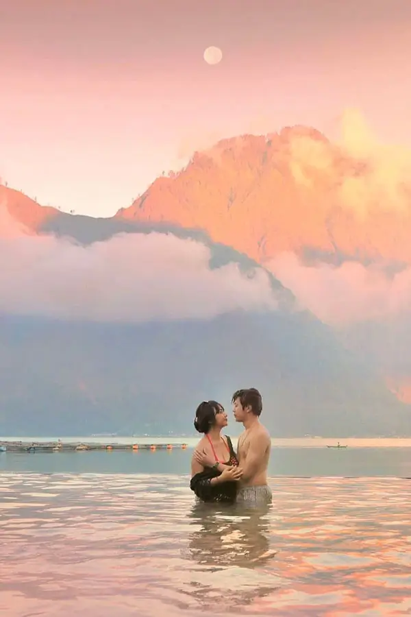 Couple relaxing in Lake Batur hot spring.