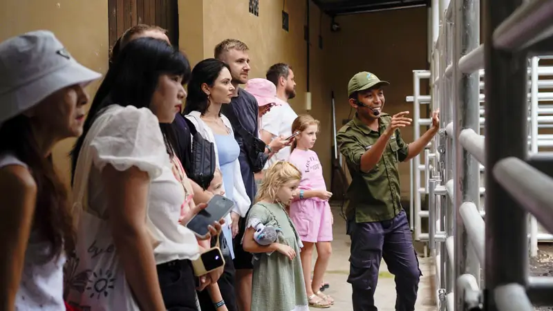 Zookeeper giving educational talk to children at Bali Zoo