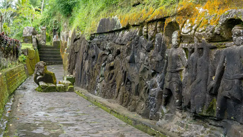 Close-up of ancient stone carvings at Yeh Pulu Temple Ubud