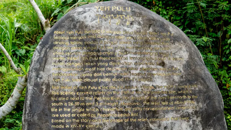 Inscribed stone explaining Yeh Pulu relief history in Ubud
