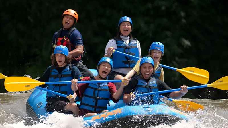 Group enjoying beginner-friendly Sobek Rafting Ayung River with smiles and light rapids in Bali