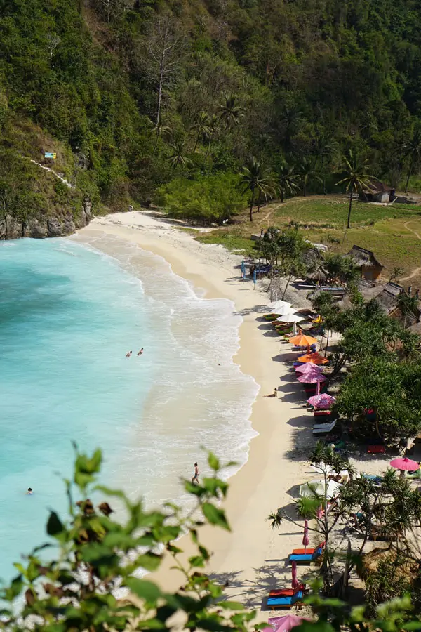 Calm beach scene with light crowds and open space for photos