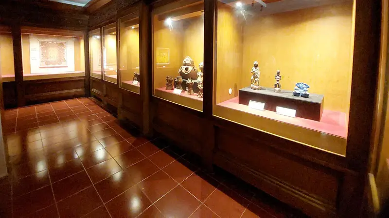 Museum gallery with Balinese artifacts, afternoon indoor plan for Bali in December