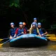 First-timers river rafting in Bali with helmets, life jackets, and guide support