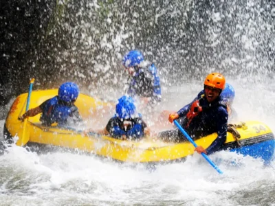 Sobek Telaga Waja rafting through a waterfall splash