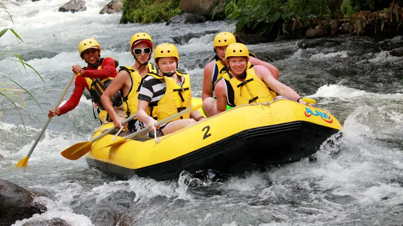 Guided white water rafting in Bali on a controlled rapid section