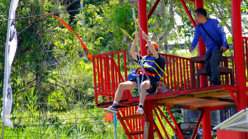 Guest starting the optional Flying Fox before rafting