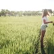 Traveler in a white T-shirt and shorts in a sunny Bali rice field