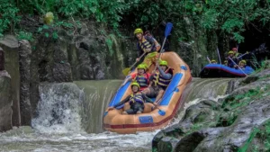 Raft descending a rocky drop on Melangit River