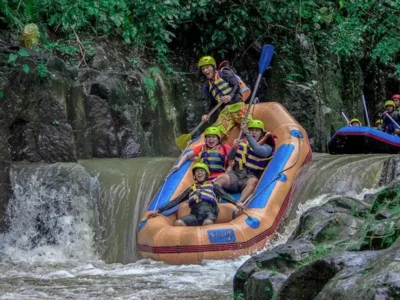 Raft descending a rocky drop on Melangit River