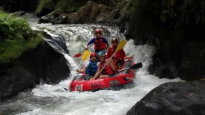 Payung Rafting boat passing through a narrow rapid in Ubud