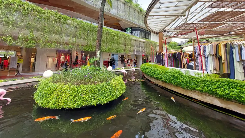 Beachwalk Shopping Center with shops and fish pond