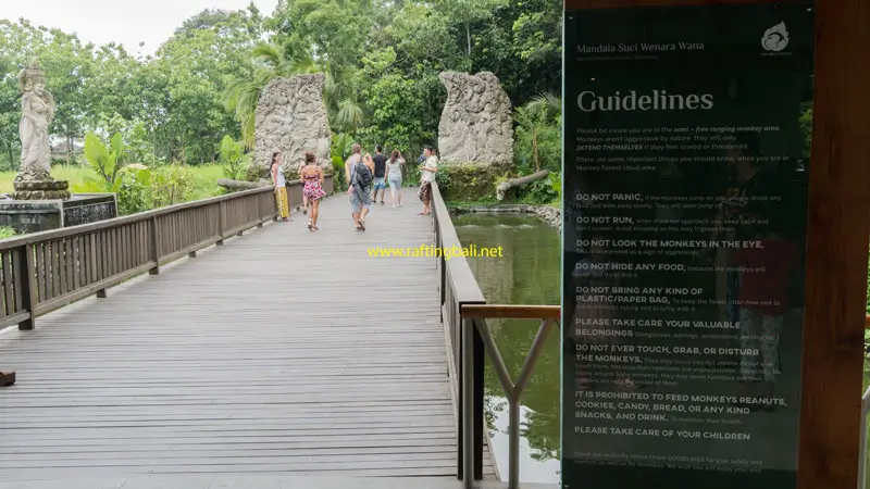 Visitor walkway and safety guidelines sign at Monkey Forest Ubud