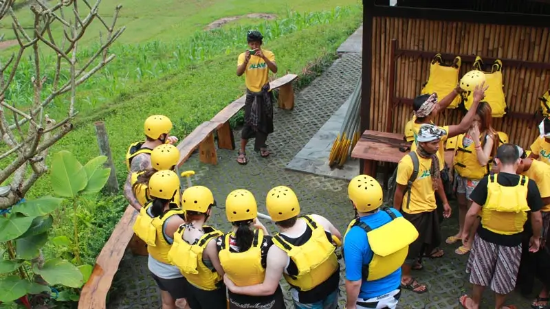 Participants wearing rafting safety gear before starting in Bali