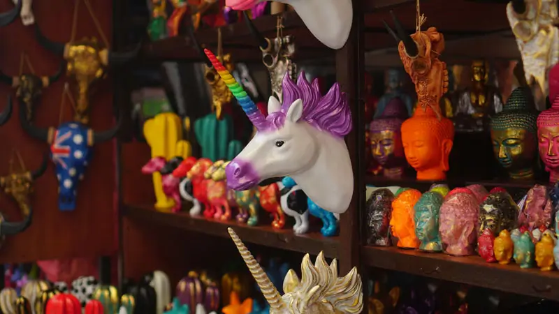 Colorful handicrafts displayed inside an art market stall