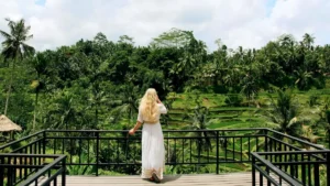 Traveler overlooking rice terraces from a viewpoint near Ubud