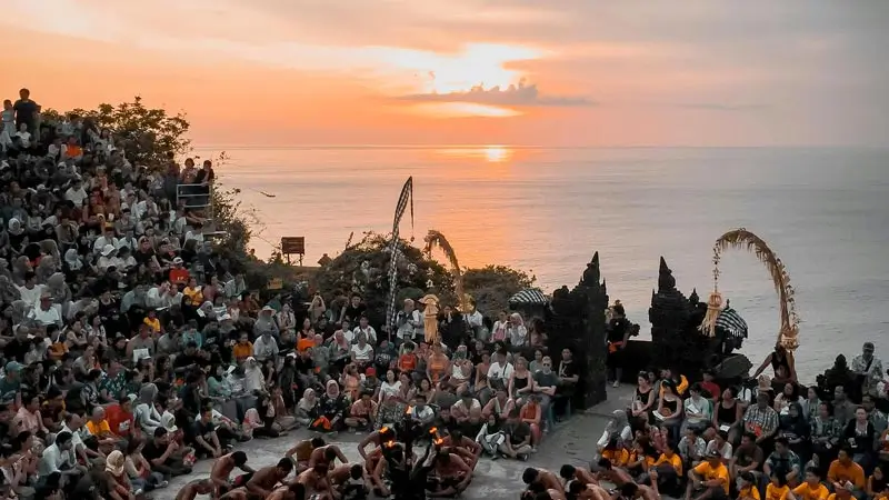 Uluwatu Kecak Dance at sunset with ocean view behind the amphitheater