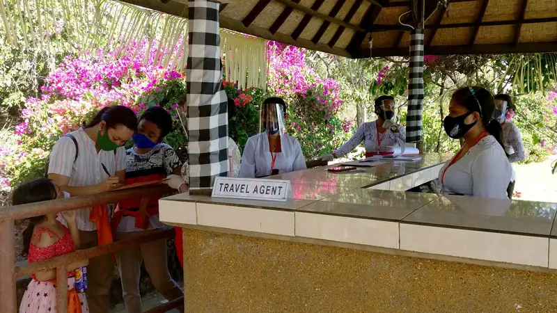 Travel agent counter used for voucher redemption